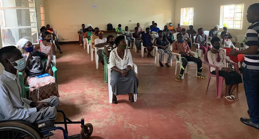 Youth listening to a facilitator during a consultative meeting to explore solutions to protect and conserve the Rweru ecosystem and biodiversity
